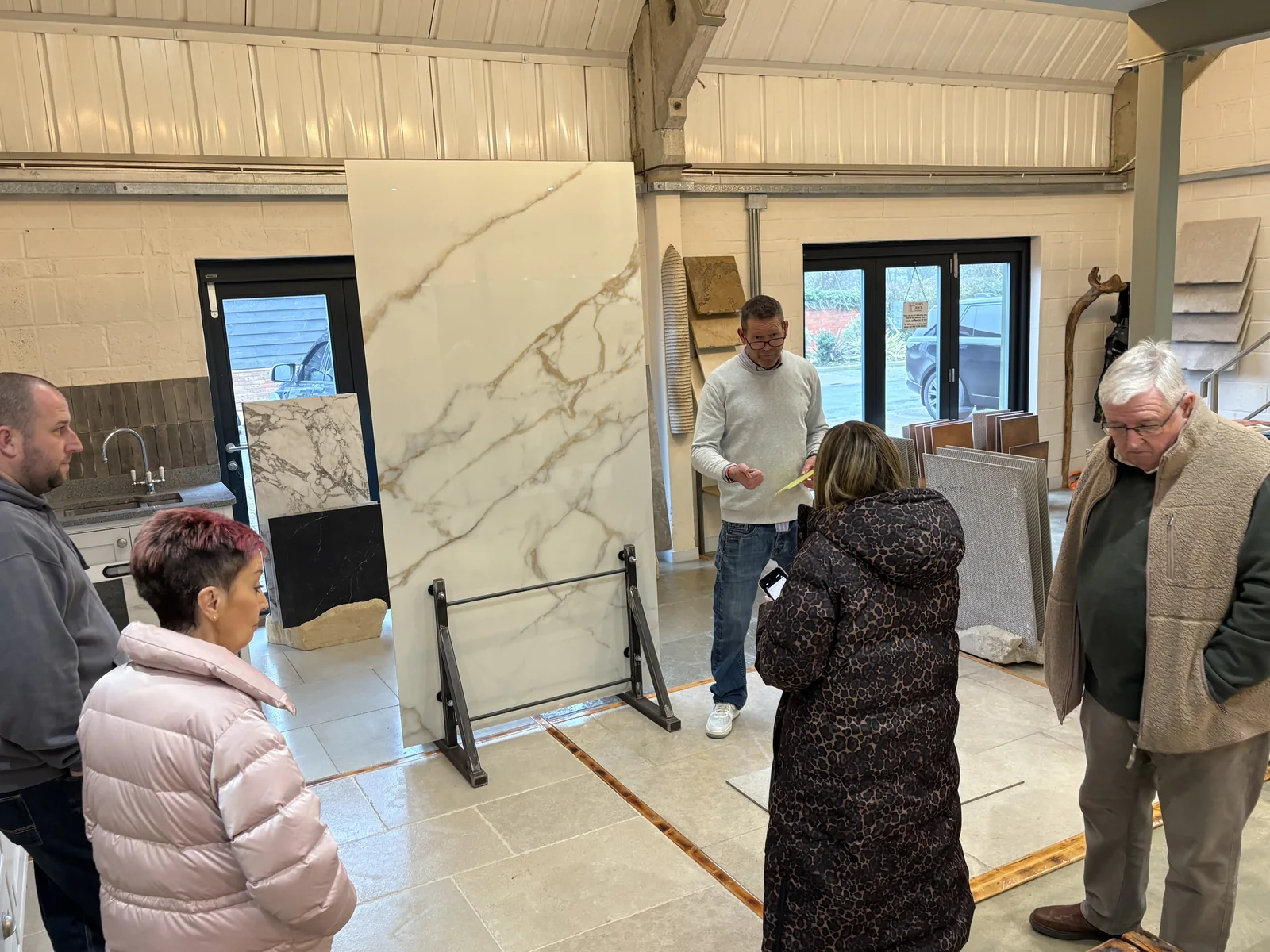 Customers choosing a porcelain slab in the Hard Rock Flooring showroom